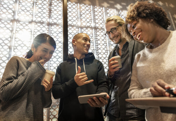 Friends looking at a smartphone